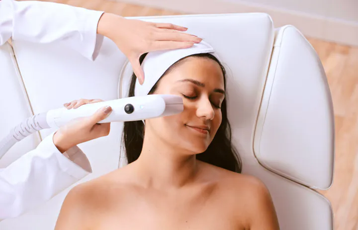 Sofwave handpiece on the cheek, skin firming available at Square Mile Clinic, City of London